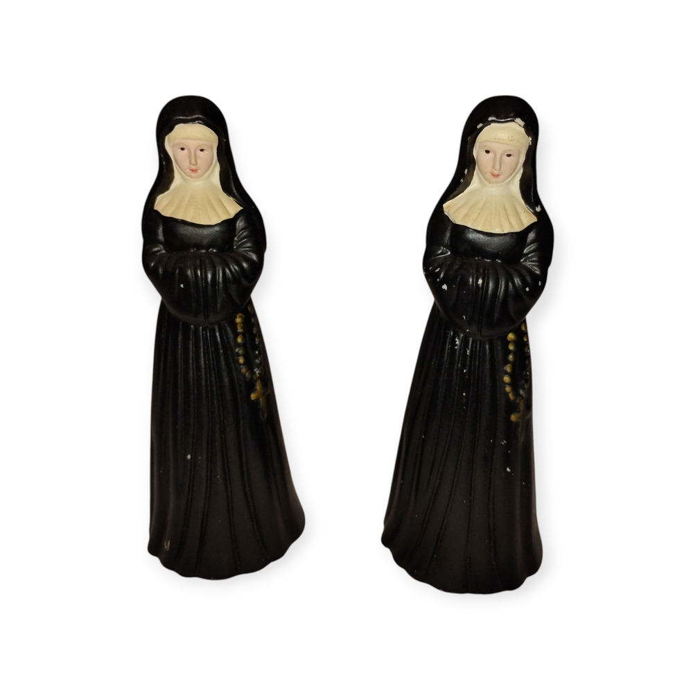 Elegant Black and Cream Figurines